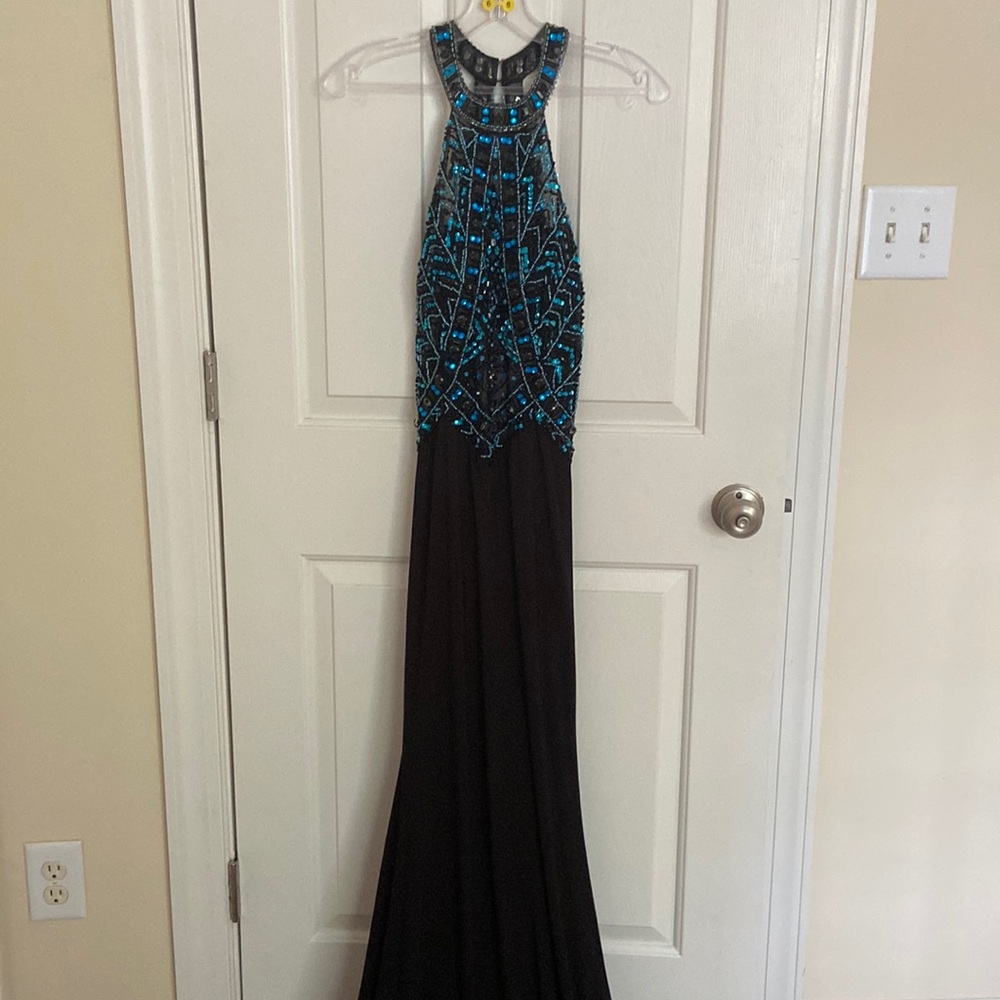Formal Gown by Glow. It is size 6, top is beaded with a low open back.